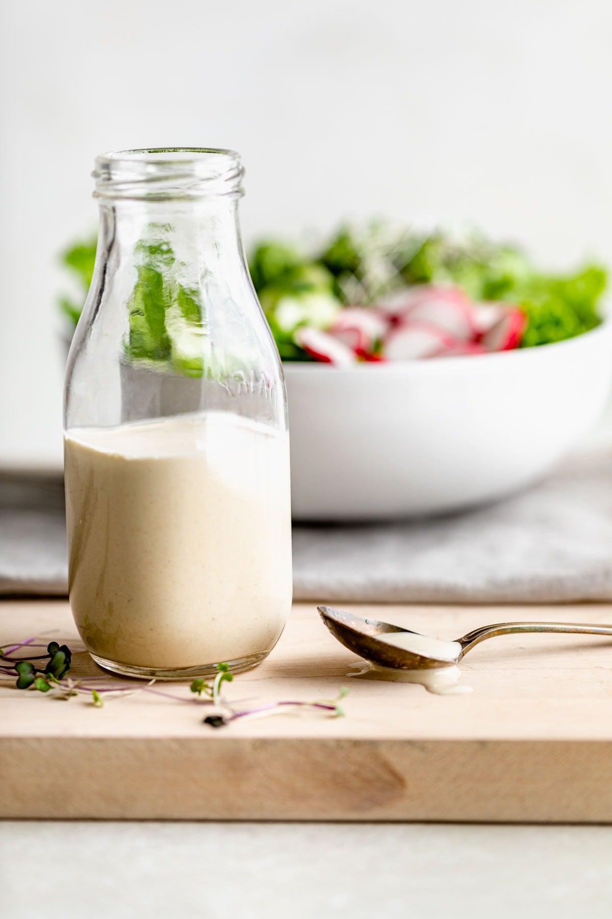 tahini dressing in a glass bottle