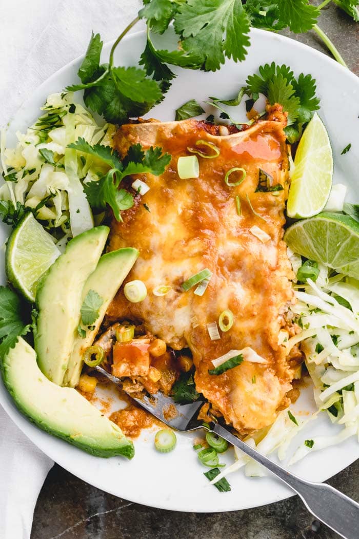 Make authentic tasting chicken enchiladas at home with this easy recipe! #chickenenchiladas #redenchiladas #healthyseasonal