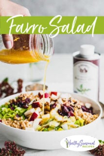 side view of farro salad being drizzled with dressing