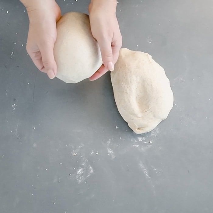 Divide the dough in half and form two tight dough balls