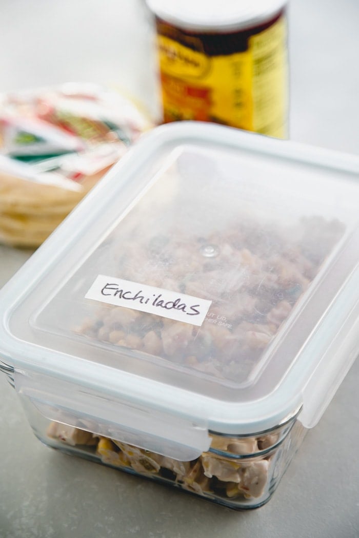 Enchiladas prep in a storage container