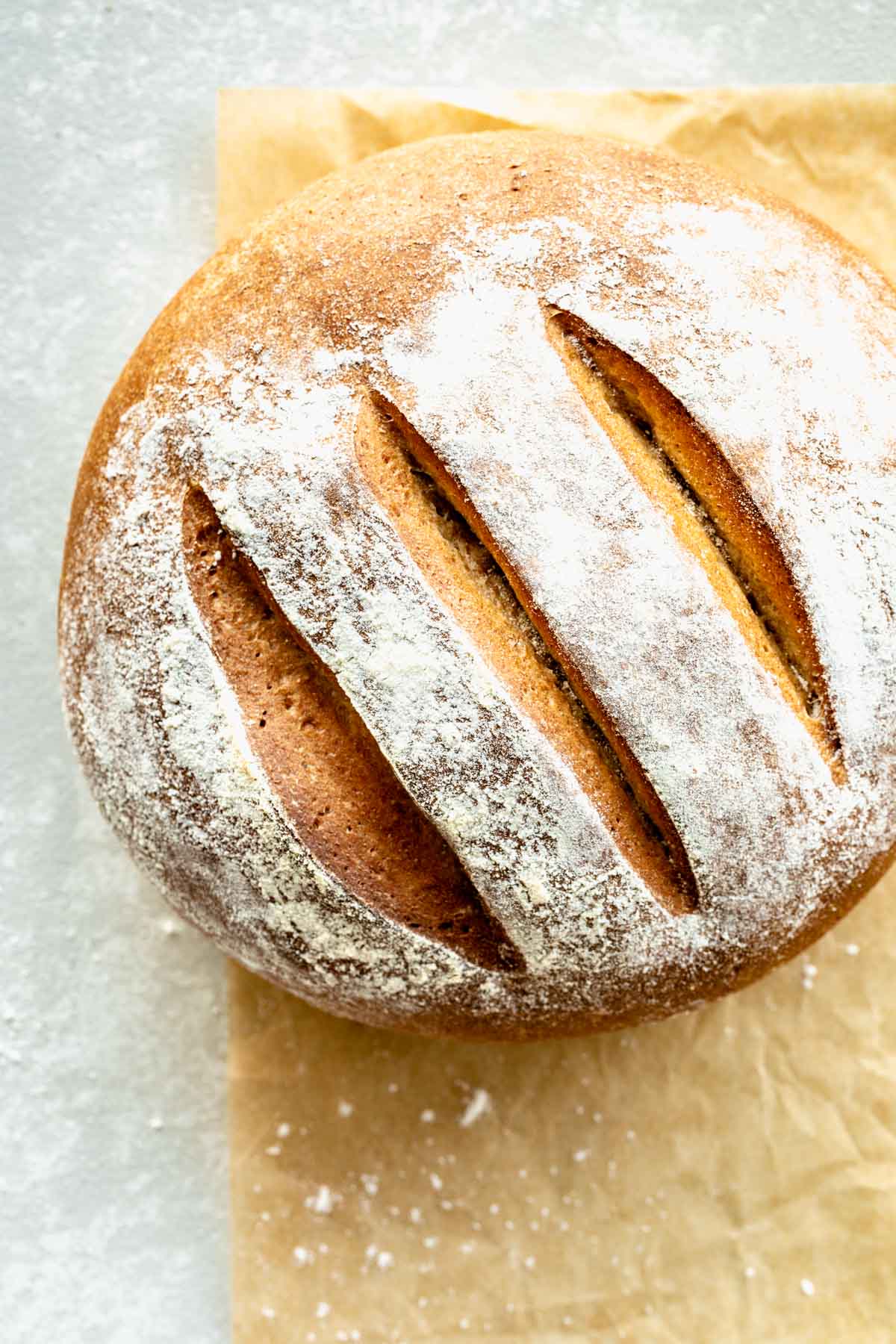 loaf of bread with three cuts decorating the top