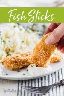 dipping a fish stick in tartar