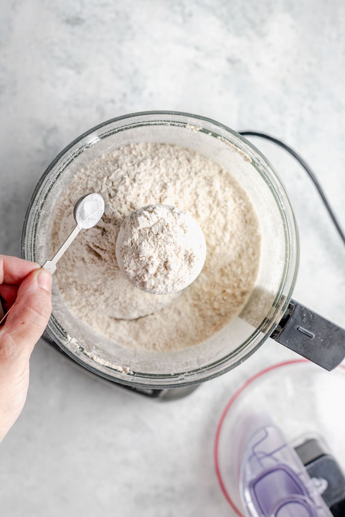 adding the dry ingredients to the ground oats