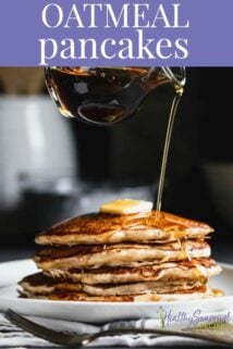 Oatmeal Pancakes with a pitcher or syrup pouring over a stack of pancakes