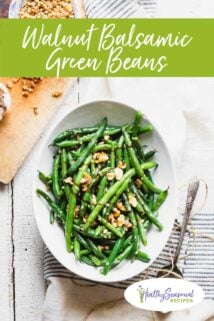 overhead of green beans with a cutting board and text overlay