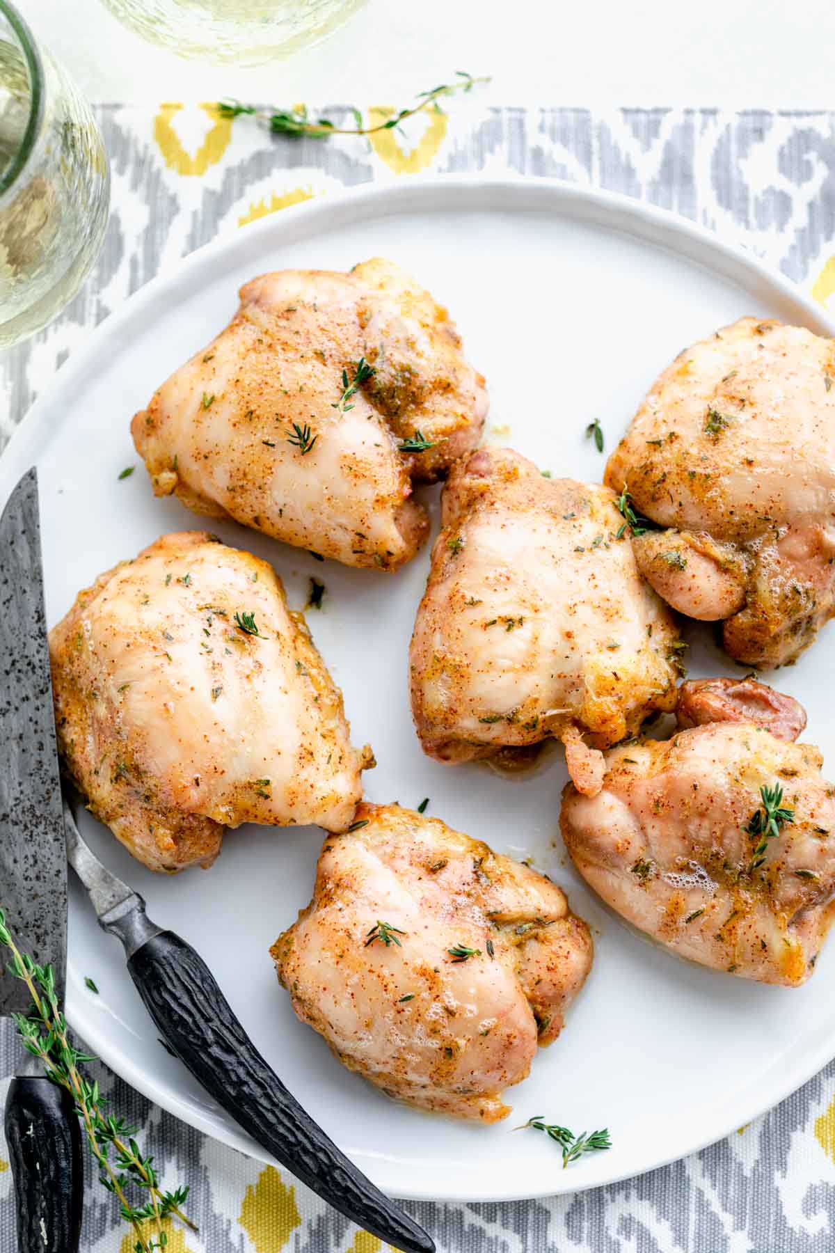 overhead of white platter with six honey mustard chicken thighs on it