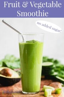 green smoothie with a stainless steel straw