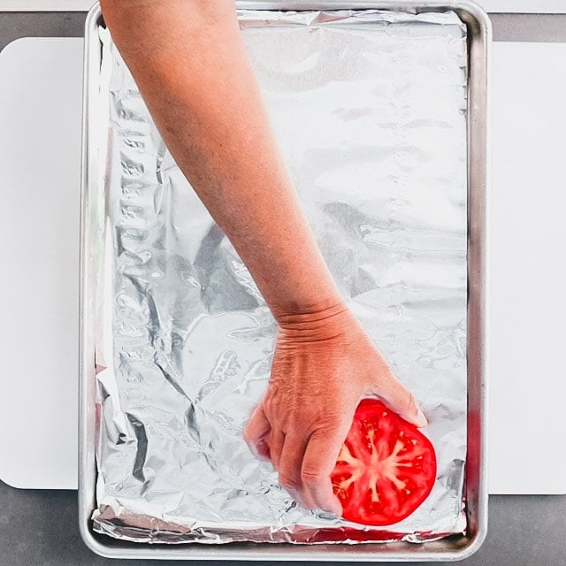 arrange tomatoes, cut side up on the sheet pan