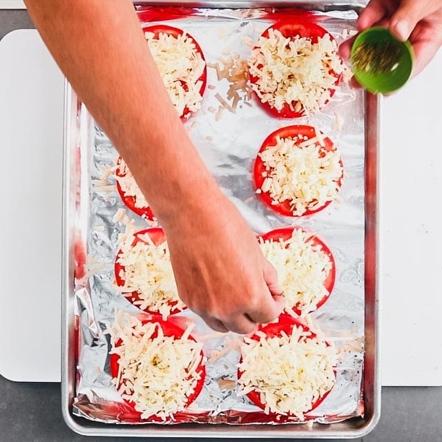 Sprinkle seasoning and pepper over the cheddar