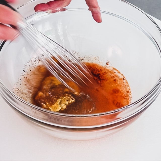 the dressing in a large bowl