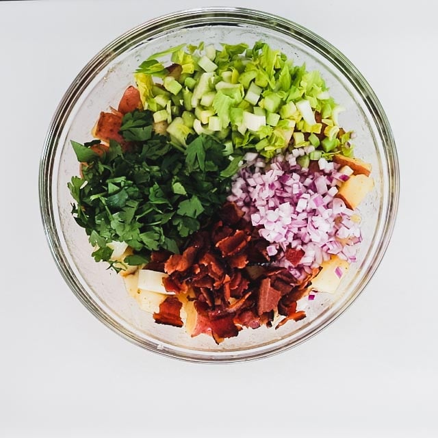 Add the bacon, parsley, celery and onion and toss to combine.
