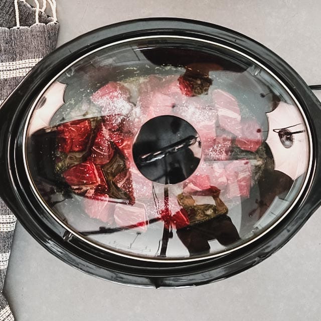 Covered slow cooker set to low heat for 8 hours.