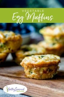 an egg muffin with veggies on a board
