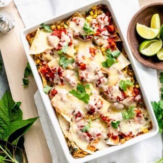 overhead show of baked chicken chilaquiles in sqaure serving dish.