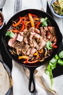 Steak fajita filling (peppers, onions and steak) in a skillet