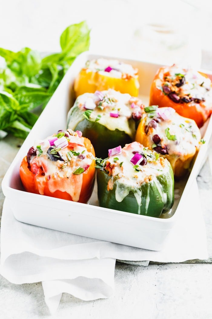 Stuffed bell peppers in a white casserole