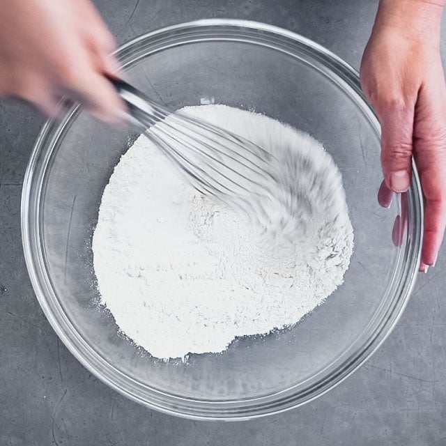 whisking dry ingredients in a bowl