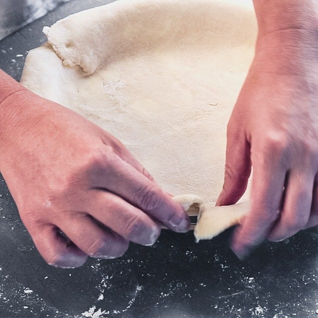 Fold under the edges of the pie dough