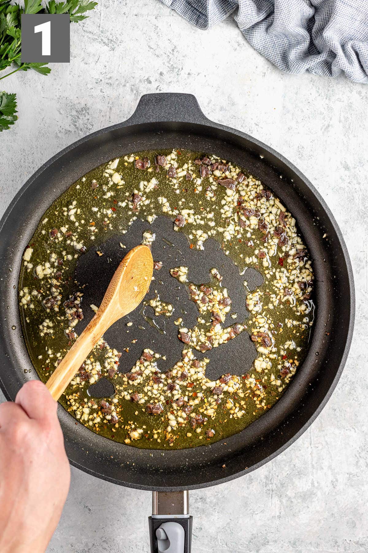 cook the garlic and anchovies first