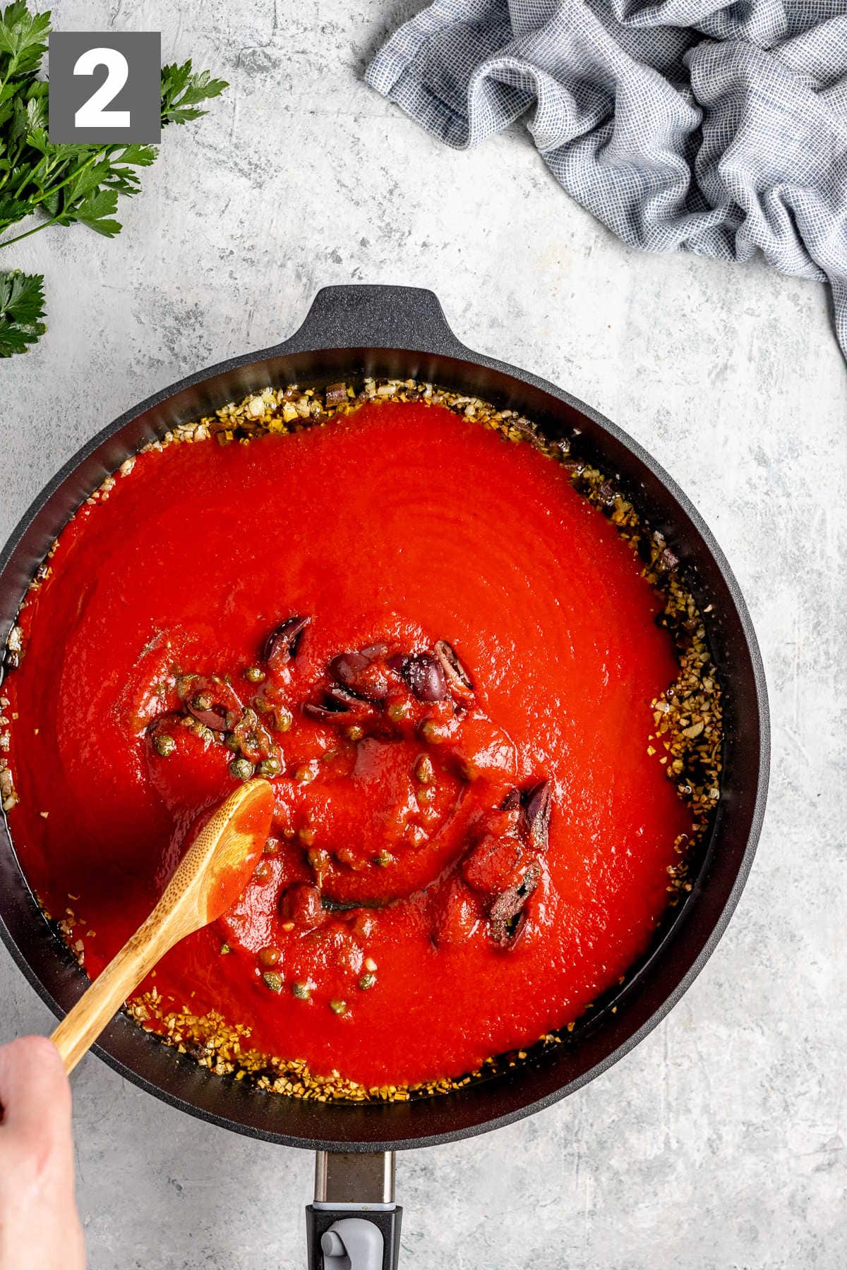 add the tomato, olives and capers