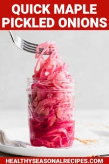 pickled onions in a jar from the side, being lifted out with a fork with text overlay
