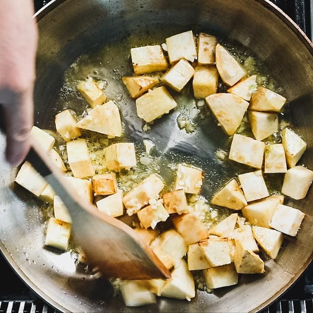 stirring in the garlic