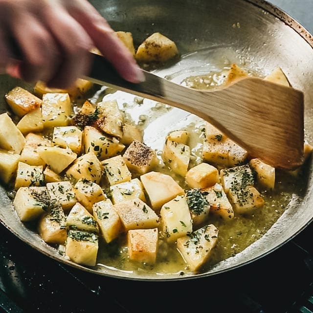 add the herbs and seasoning to the skillet.