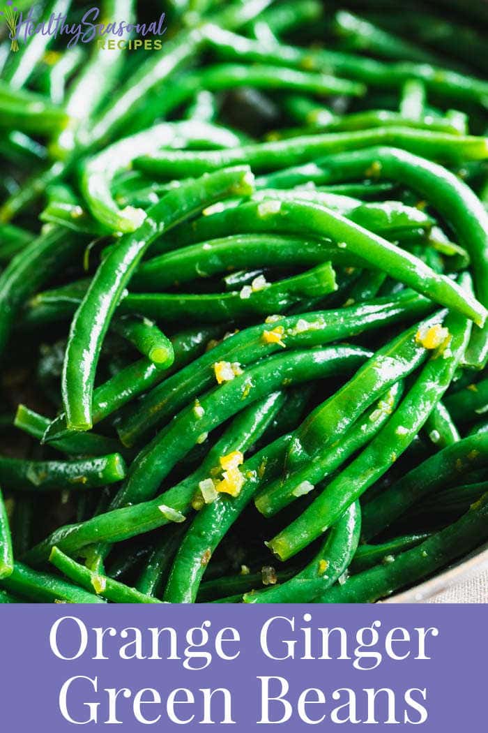 close up of green bean with orange zest on them