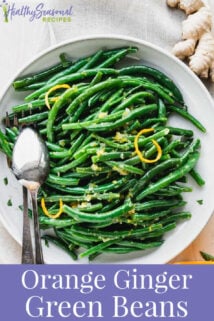 close up of green bean with orange zest on them