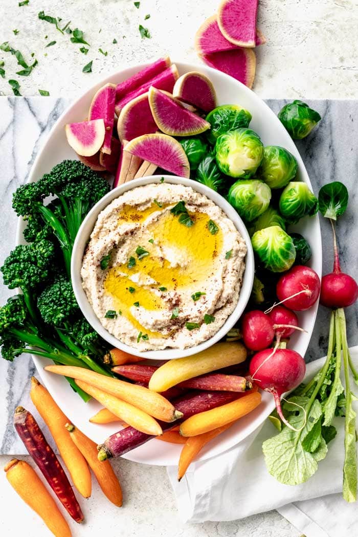 Cauliflower hummus on a platter of veggies