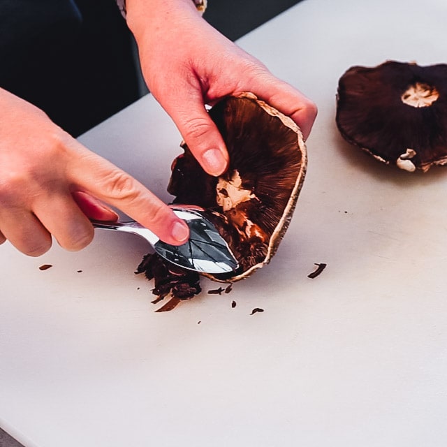 scrape the gills from the mushroom cap
