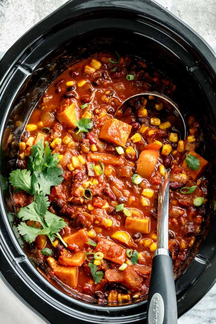 The slow cooker from above with the chili in it