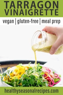 pouring tarragon dressing over a salad with colorful veggies