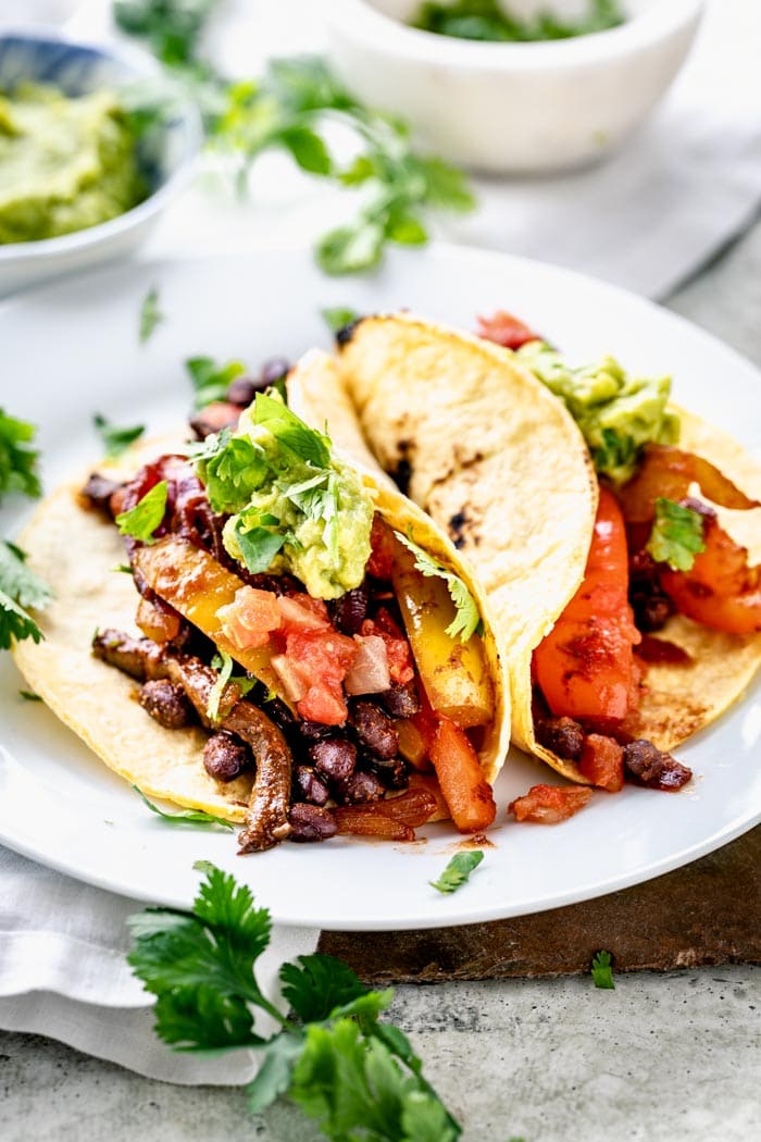 vegan tacos on a plate from the side