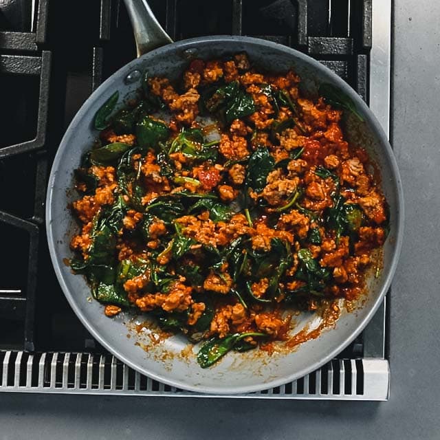 add the spinach and marinara and cook until the spinach is wilted