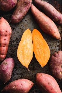 sweet potatoes on a dark background with one split in half