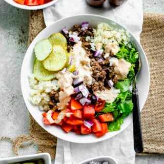 burger bowl in a white bowl with a fork
