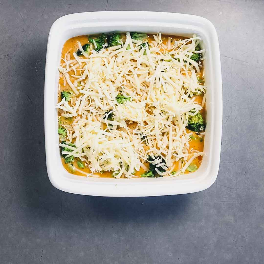 the egg and cheese in the casserole dish before it is baked