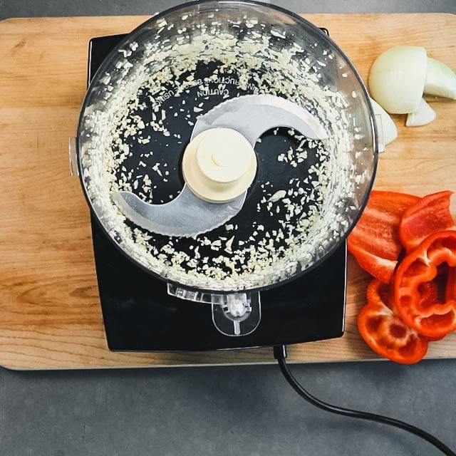 the garlic in the food processor after it is finely chopped