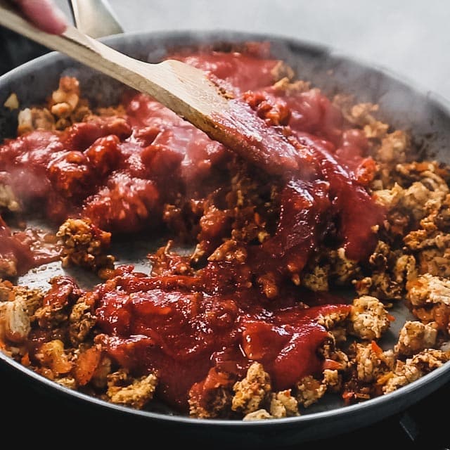 stir the canned tomato into the chicken and veggie mixture