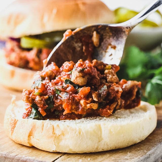 topping the bun with filling