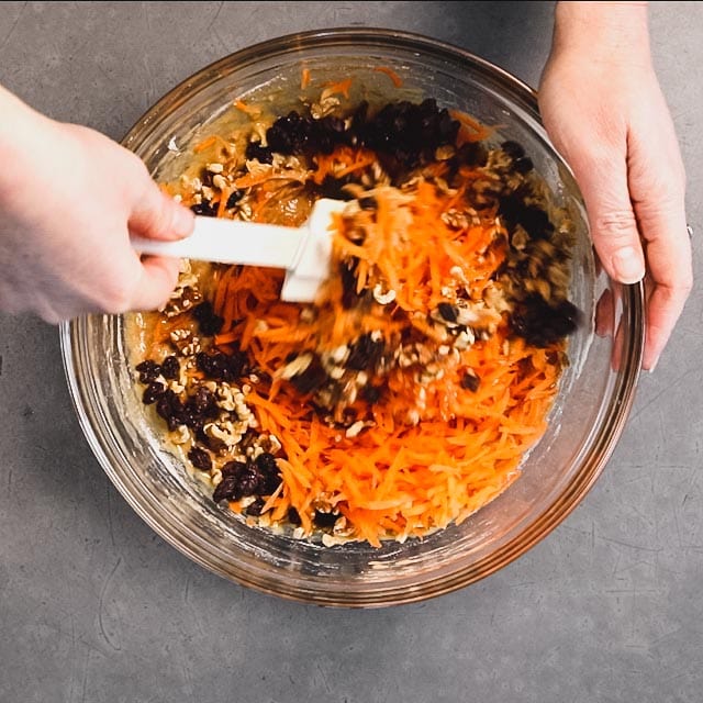 Add the shredded carrots, raisins and nuts to the batter and gently combine