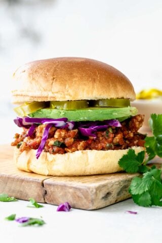 a side view of sloppy joe on a cutting board.