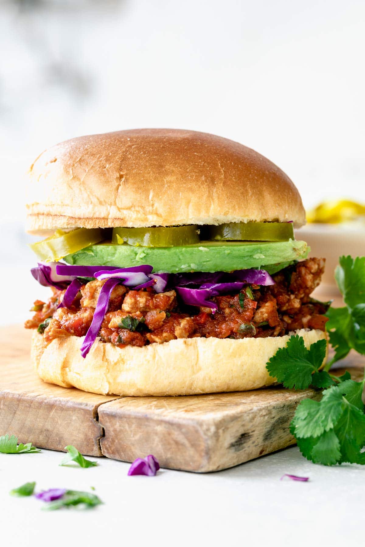 a side view of sloppy joe on a cutting board.