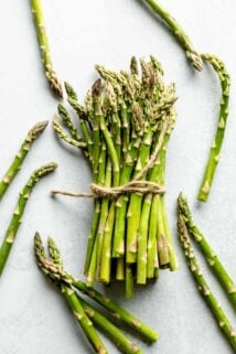 A bunch of asparagus stalks tied with twine