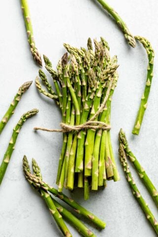 A bunch of asparagus stalks tied with twine