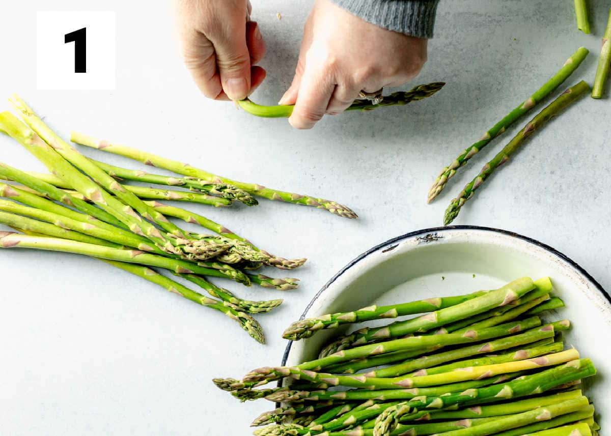 snapping the woody ends off the asparagus