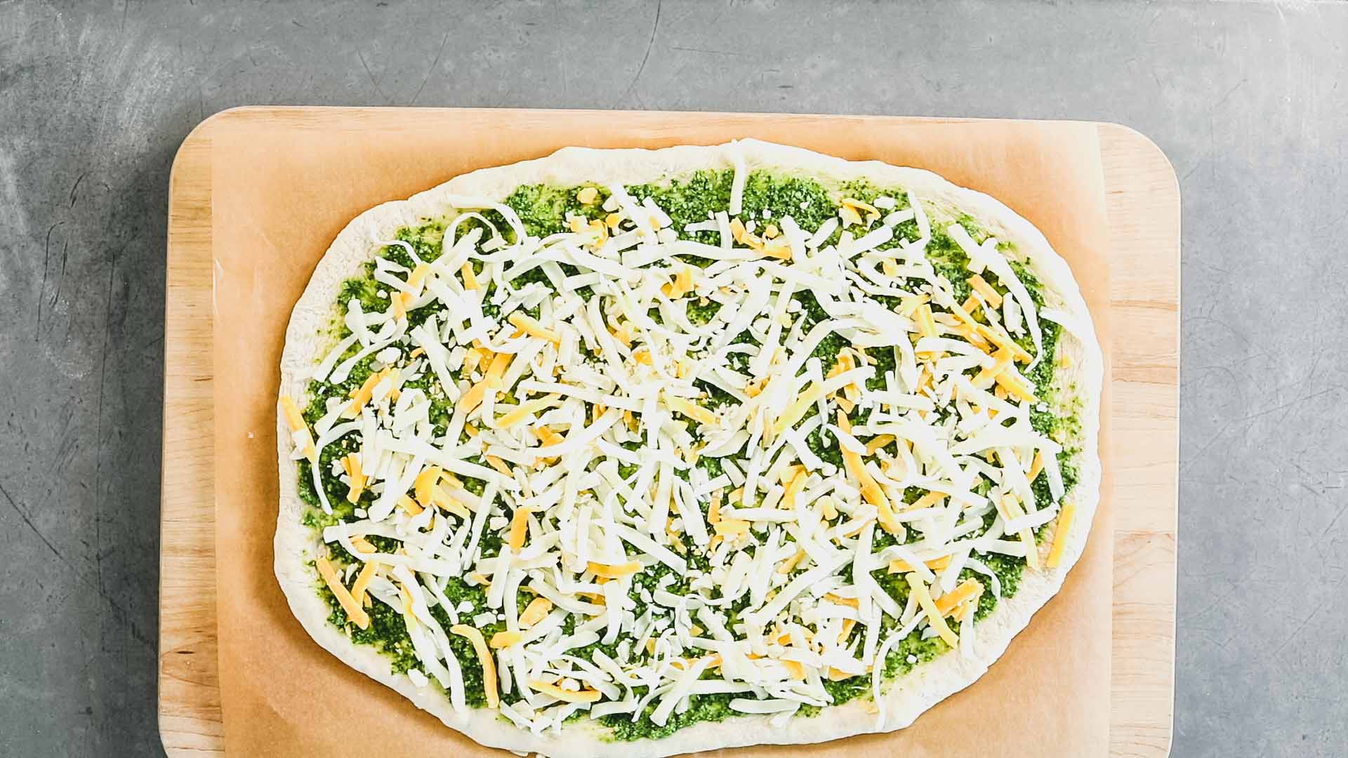 the pizza with cheese and pesto from overhead
