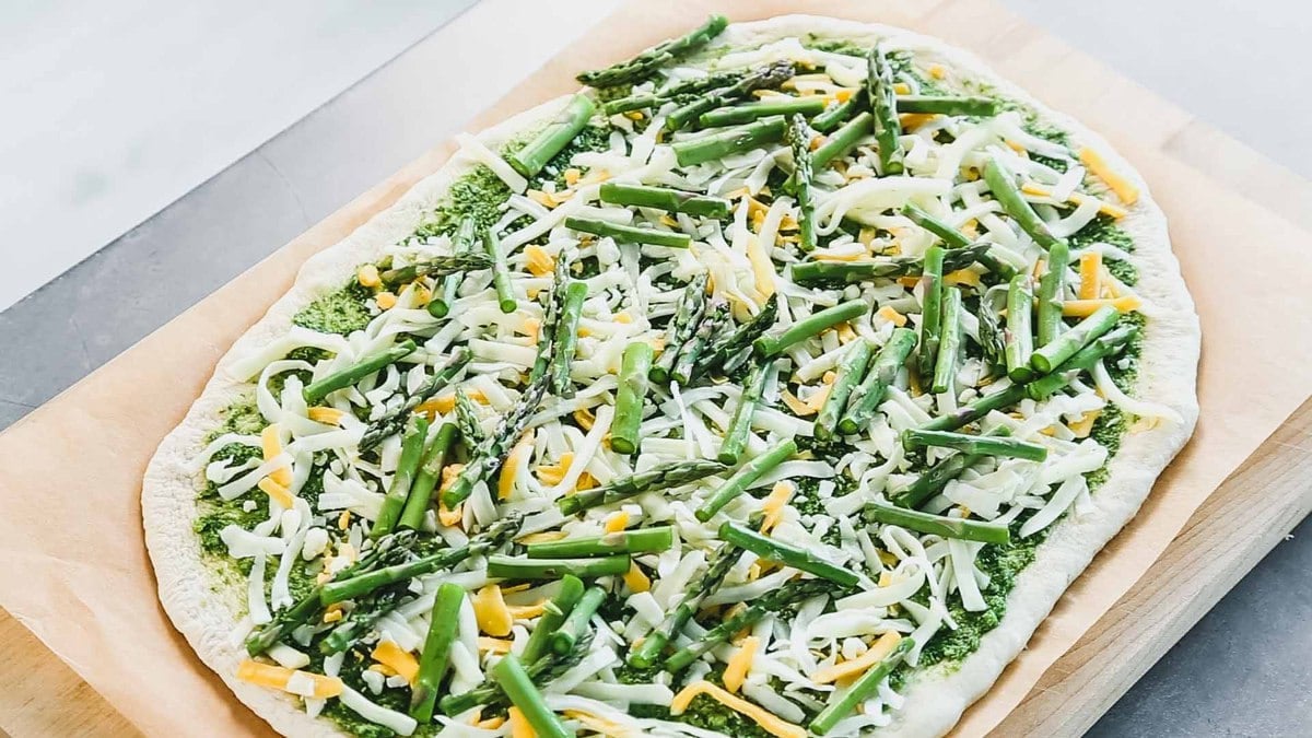 the pizza before it is cooked